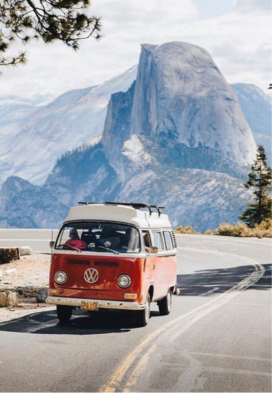Red Camper Van on a Mountain Road Greeting Card