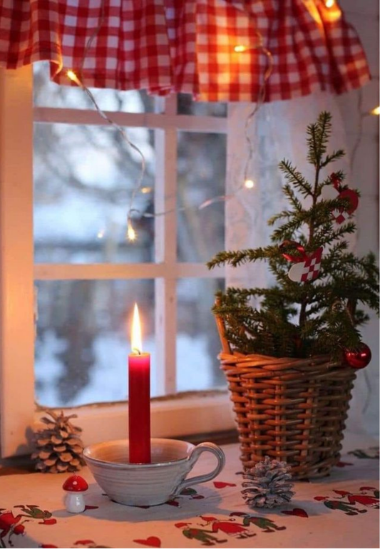 Glowing Candle in a Winter Cottage Window Greeting Card